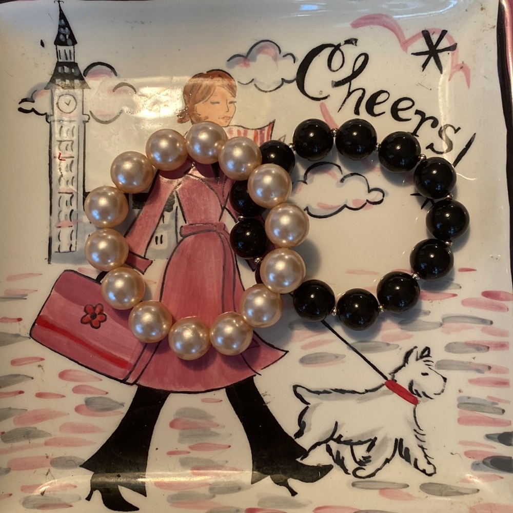 Two stretch bracelets one black, one white